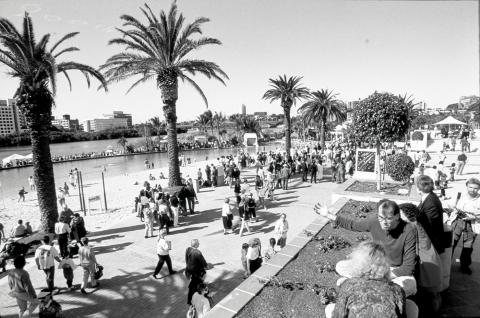 Loads of people visiting Southbank beach, in inner-city Brisbane