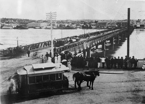 Victoria Bridge with flood waters and horse-drawn tram in foreground, 1893