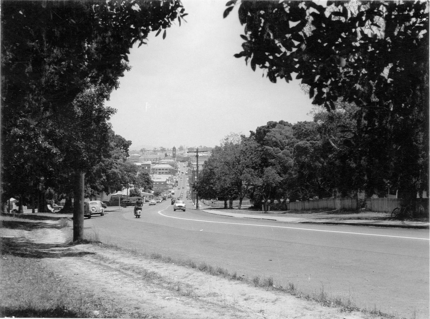 Street view of Limestone Street featuring traffic and buildings.